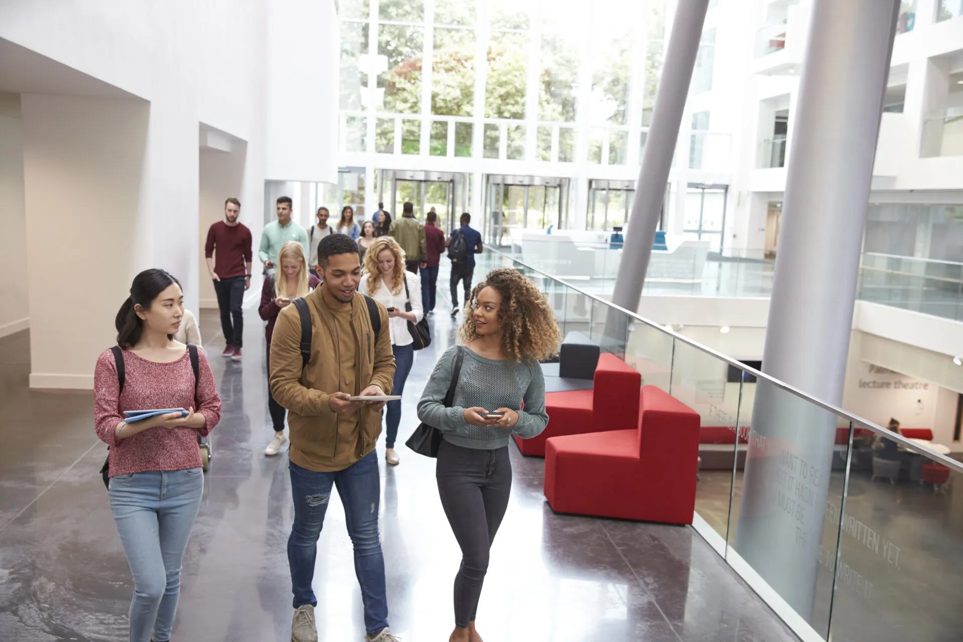 Group of college students in a building hallway